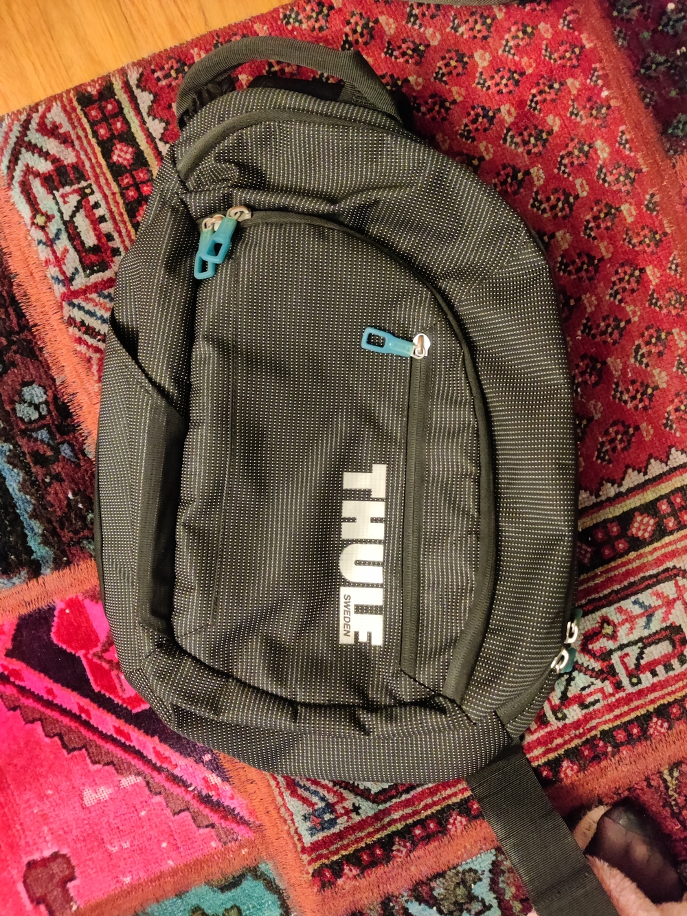 Thule Black Dotted Sling Pack with Teal Accents